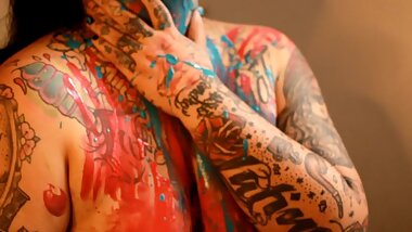 Beautiful Tattooed Girl with Paint Strokes